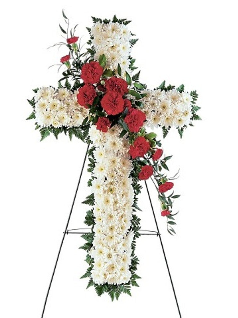 Send your thoughts and prayers with this beautiful floral cross. All white cushion mums with an accent spray of red carnations. Simply stunning.

Arrangement will be as close as possible, but may not be exact. Flower variety may vary depending on seasonal availability.