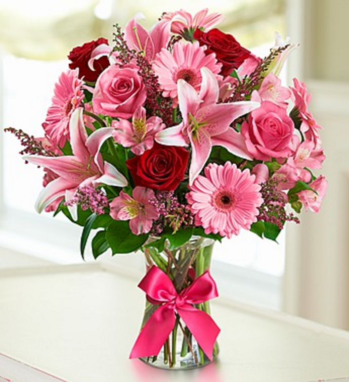 Our most popular flowers all in one arrangement: stargazer lilies, roses and gerbera daises just to name a few. Pinks and reds.   Vase and/or flower variety will vary depending on availability. Arrangement will be as close as possible, but may not be exact. 